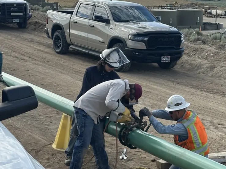 Titan Construction welders working on a pipeline in the field